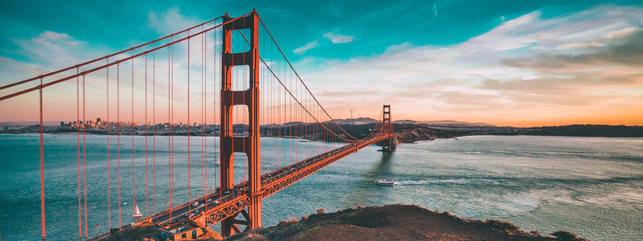 The Golden Gate Bridge above San Francisco Bay at sunset